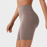 Pantalones cortos deportivos moldeadores de 7" – Con control abdominal, efecto lifting y bolsillos prácticos