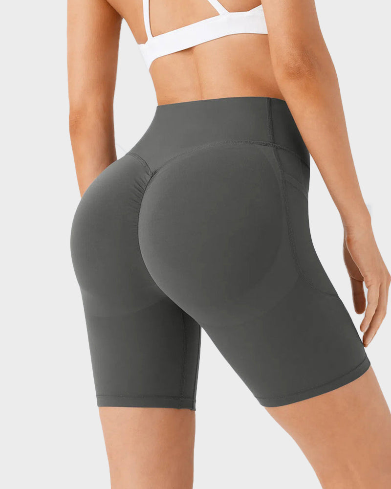 Pantalones cortos deportivos moldeadores de 7" – Con control abdominal, efecto lifting y bolsillos prácticos